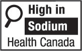 This figure shows a nutrition symbol for the principal display panel that indicates that a prepackaged product is high in sodium. This symbol is in English only. There is a white rectangular box outlined by a thin black line. At the top left of the box is a black magnifying glass. To the right of the magnifying glass is the heading “High in” in black, bold, lower case letters, except that the first letter of the first word is in upper case. Under the heading is one horizontal bar. There is a small amount of white space between the right side of the bar and the thin black line that outlines the box. The bar is black and contains the word “Sodium” in white, bold, lower case letters, except that the first letter is in upper case. Centred at the bottom of the box are the words “Health Canada” in black, lower case letters, except that the first letter of each word is in upper case.