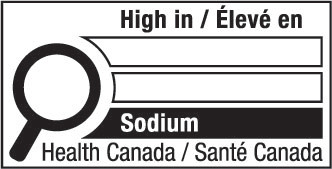 This figure shows a nutrition symbol for the principal display panel that indicates that a prepackaged product is high in sodium. This symbol is bilingual, with the English text shown first, followed by the French text. There is a white rectangular box outlined by a thin black line. At the top of the box is a heading composed of the words “High in” followed by a forward slash and the words “Élevé en” in black, bold, lower case letters, except that the first letter of the words “High” and “Élevé” are in upper case. Under the heading is a left-justified black magnifying glass with three bars stacked to its right. There is a small amount of white space between the magnifying glass and the left side of the three bars. This left side forms a concave curve that follows the curvature of the magnifying glass. There is a small amount of white space between each bar, as well as between the right side of the bars and the thin black line that outlines the box. The first and second bars are white, are outlined by a thin black line and contain no words. The third bar is black and contains the word “Sodium” in white, bold, lower case letters, except that the first letter is in upper case. Centred at the bottom of the box are the words “Health Canada” followed by a forward slash and the words “Santé Canada” in black, lower case letters, except that the first letter of each word is in upper case.